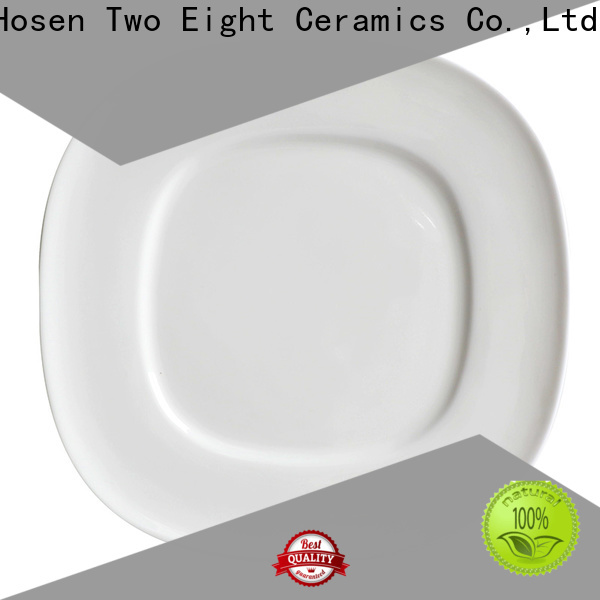 Two Eight white porcelain plates company for dinner